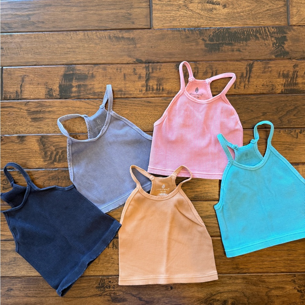 Bundle of FP Movement Racerback Tanks. Colors: caramel, pink, teal, navy & gray